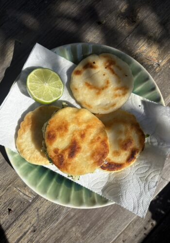 This image shows an Arepa Reina Pepiada made with chicken and avocado